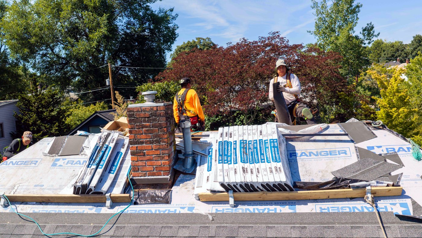 Liberty in-house crew installing shingles on a Pacific Northwest roof